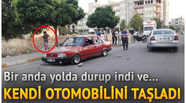 Sinir krizi geçiren genç otomobilini taşladı