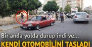 Sinir krizi geçiren genç otomobilini taşladı