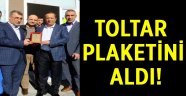 Toltar plaketini aldı!